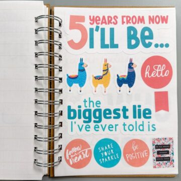 A journal decorated with colorful stickers, including llamas, motivational phrases, and text like "5 Years From Now I'll Be..." and "The biggest lie I've ever told is."