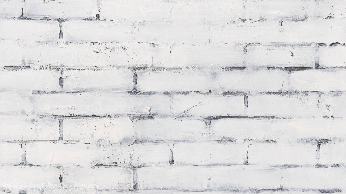 Finished faux brick wall with a lightly distressed, textured surface and defined mortar lines, creating the look of aged brick on a flat wall.