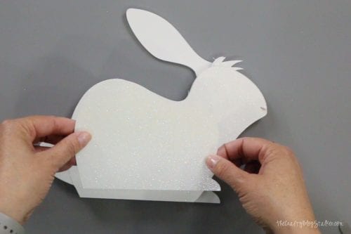 layering the pieces of the 3d paper art bunny
