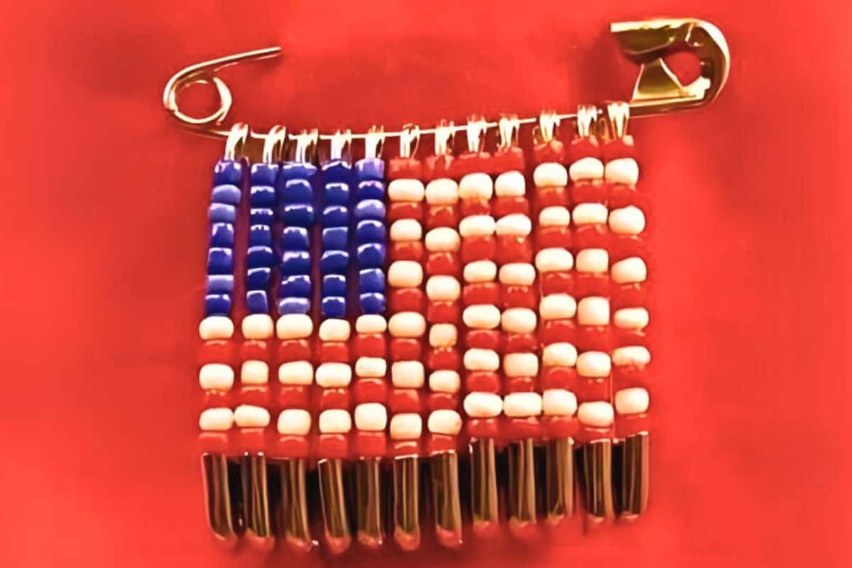 Safety pin United States Flag made with beads.