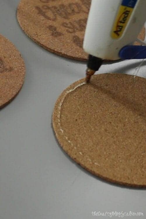 How to Make Wood Burning Cork Coasters with a Scorch Marker featured by top US craft blog, The Crafty Blog Stalker - hot glue gun