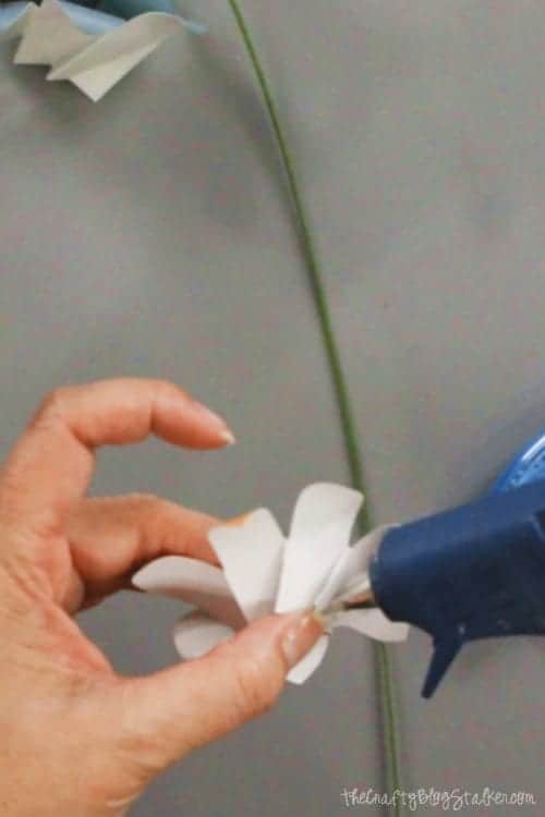 image of gluing the bas of the paper flower together