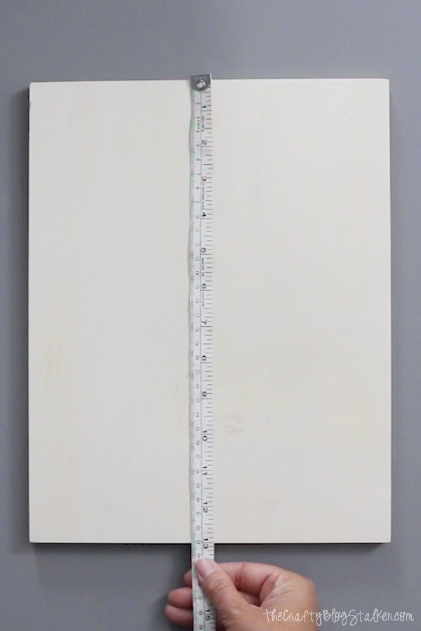 image of measuring a blank wood sign