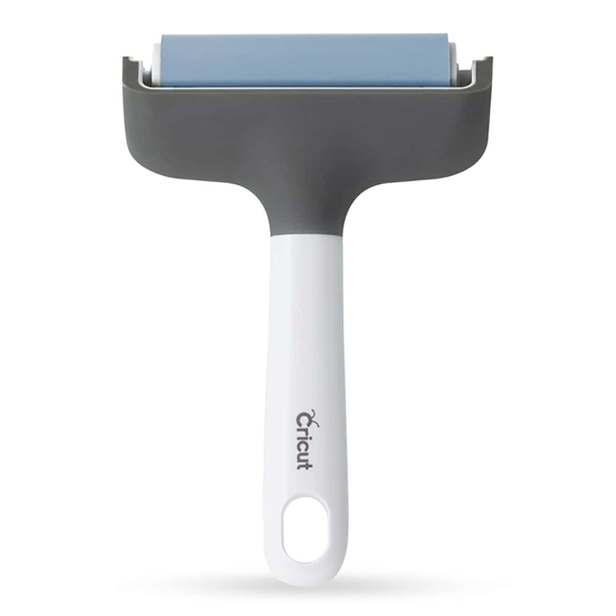 Cricut brayer tool with a gray frame, blue roller, and white handle designed for smoothing materials onto cutting mats.