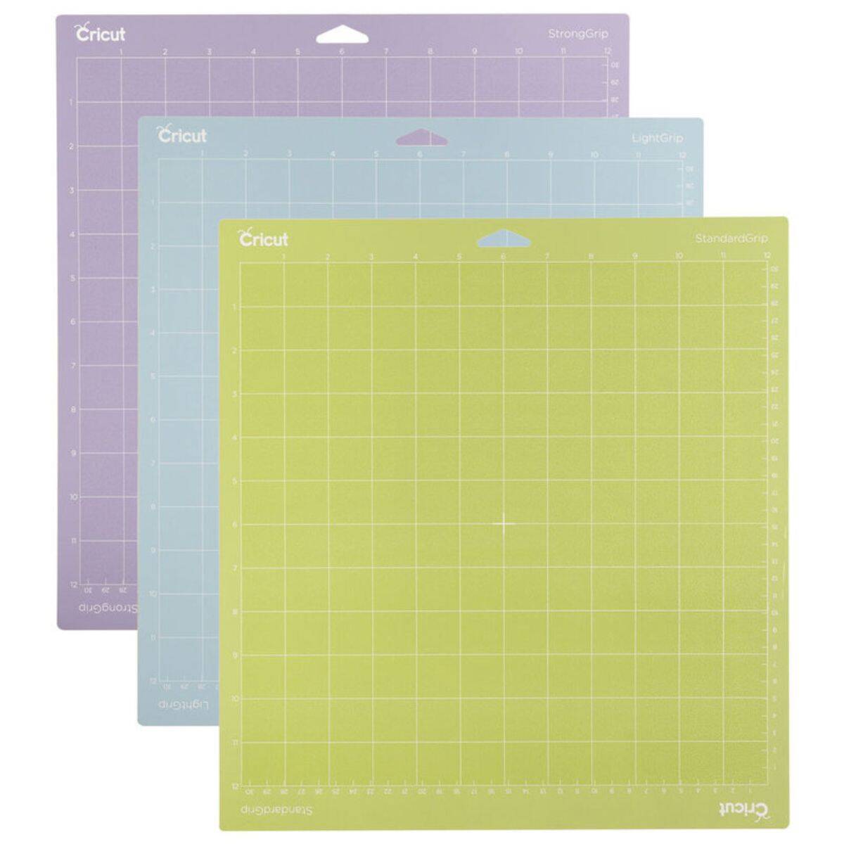 A set of three Cricut cutting mats in green, blue, and purple, each with a grid layout and labeled for StandardGrip, LightGrip, and StrongGrip projects.