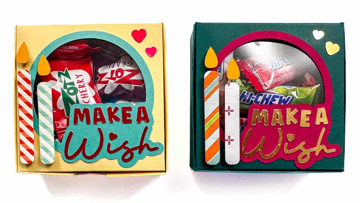 Two decorated gift boxes with “Make a Wish” designs, birthday candles, and heart accents, each filled with assorted wrapped candies.