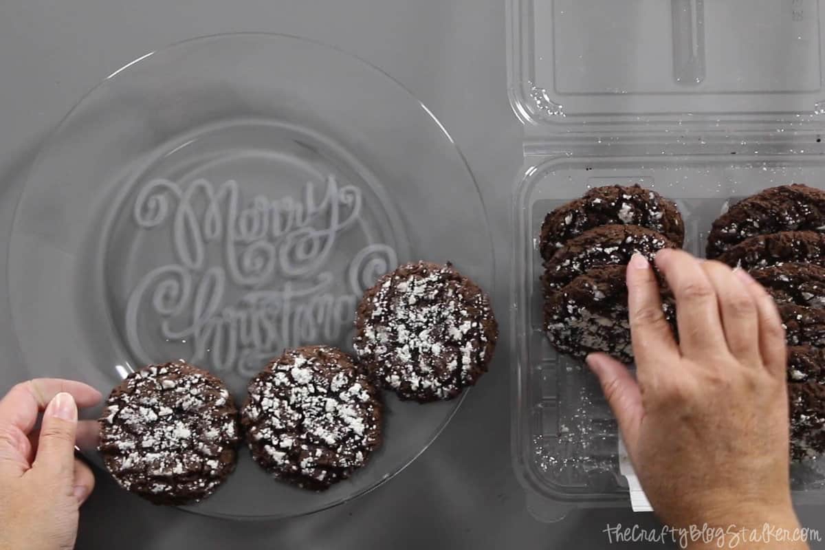 Placing chocolate cookies on a Glass Etched Cookie Plate.