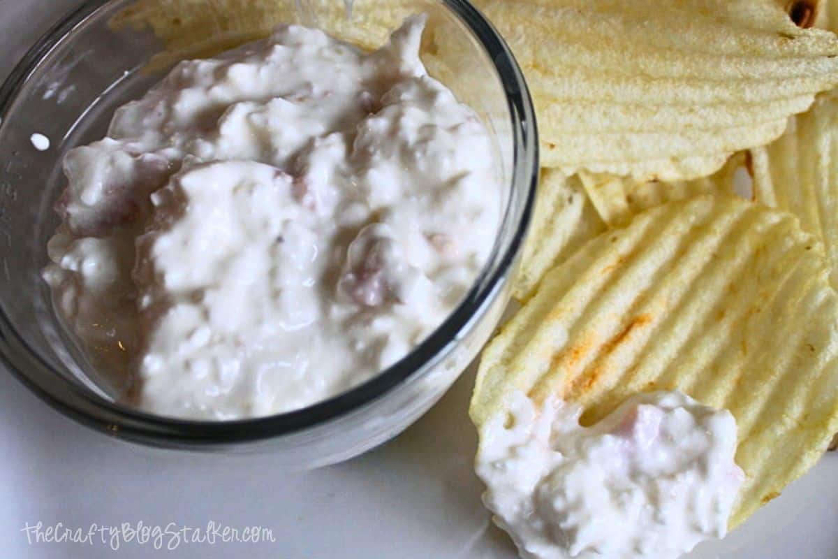 Bowl of Cottage Cheese Clam Dip with potato chips.