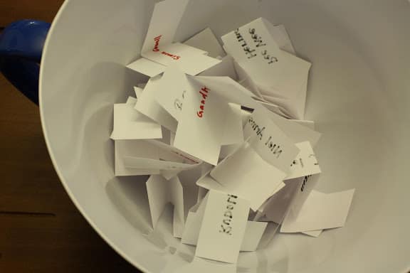 A large bowl filled with folded strips of paper.