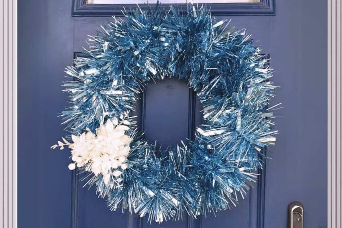 Winter garland wreath hanging on a front door.