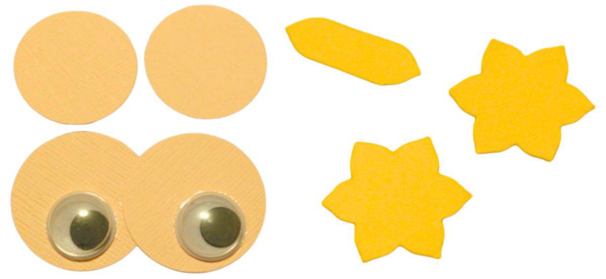 Paper punch shapes to make the eyes, feet, and beak of the owl.