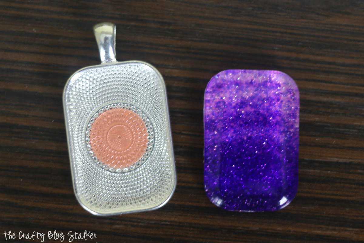 apply a glue dot to the pendant tray and lay the glass tile inside