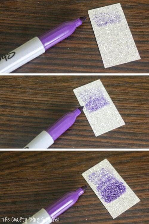 coloring ombre with a purple sharpie marker on a rectangle of glitter paper