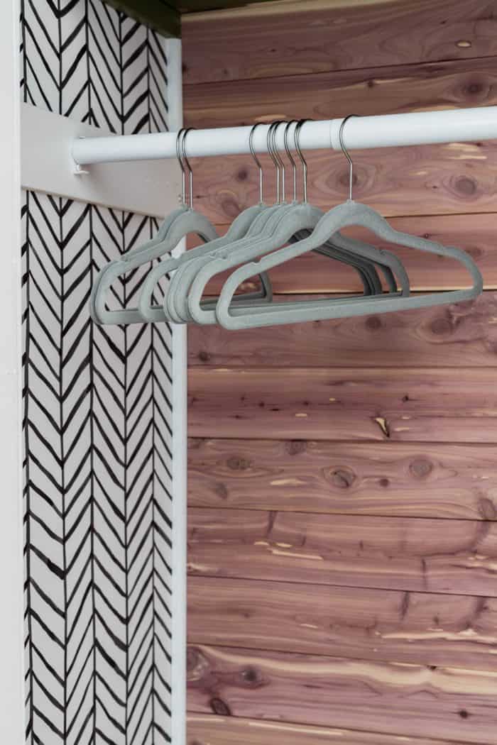 velvet coat hangers in boys closet with cedar planks 