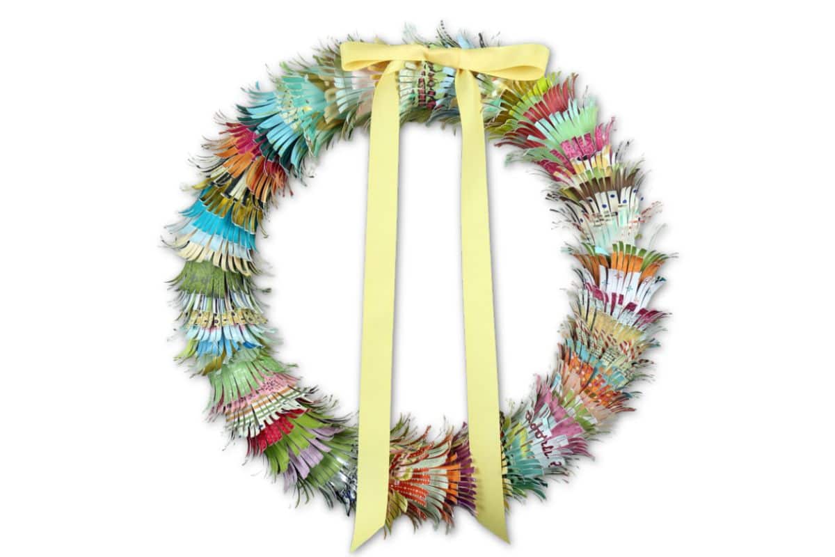 Paper wreath made with scrap paper and fringe scissors.