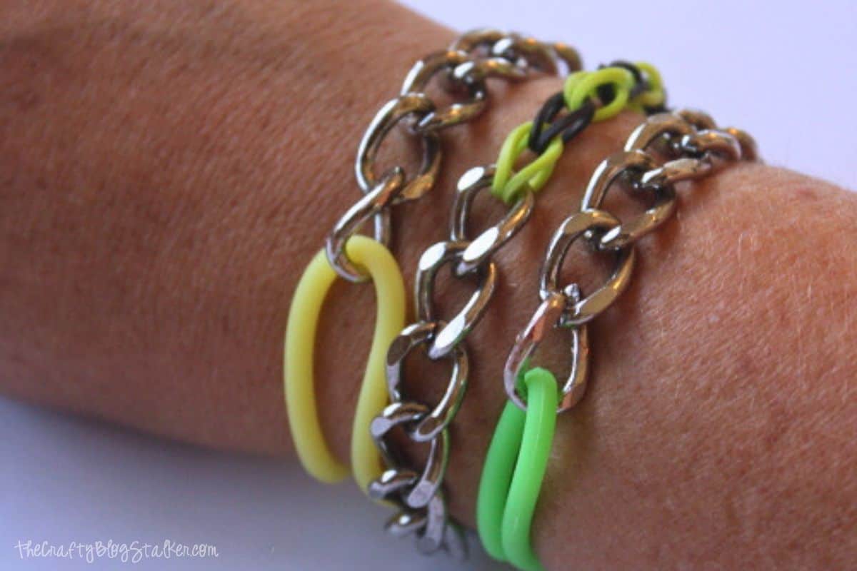 Three stackable bracelets on a wrist.