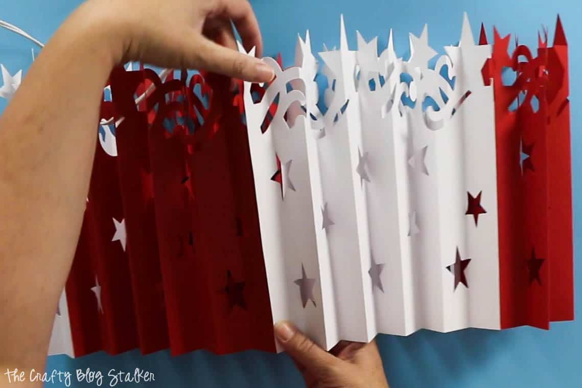 attaching accordion folded pieces for the Large DIY Patriotic Paper Rosette with Cricut