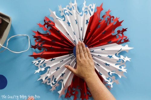 hot glue circle to the center of the  Large DIY Patriotic Paper Rosette to hold it all together