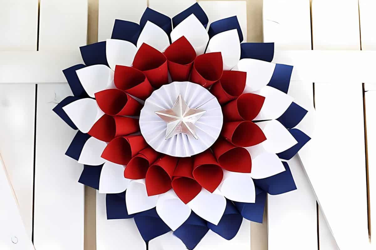 Large Patriotic flower wreath made with red, white, and blue paper.
