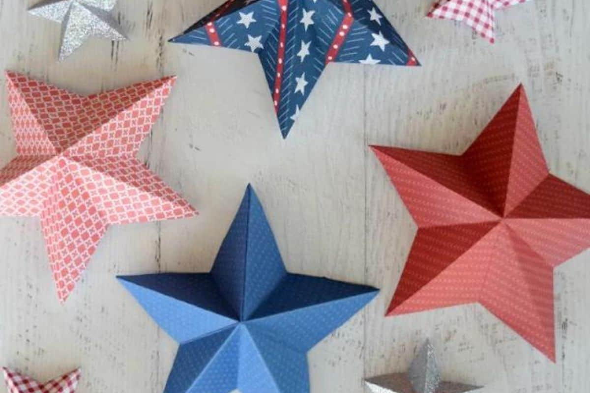 3D stars made out of red, white, and blue patterned paper.