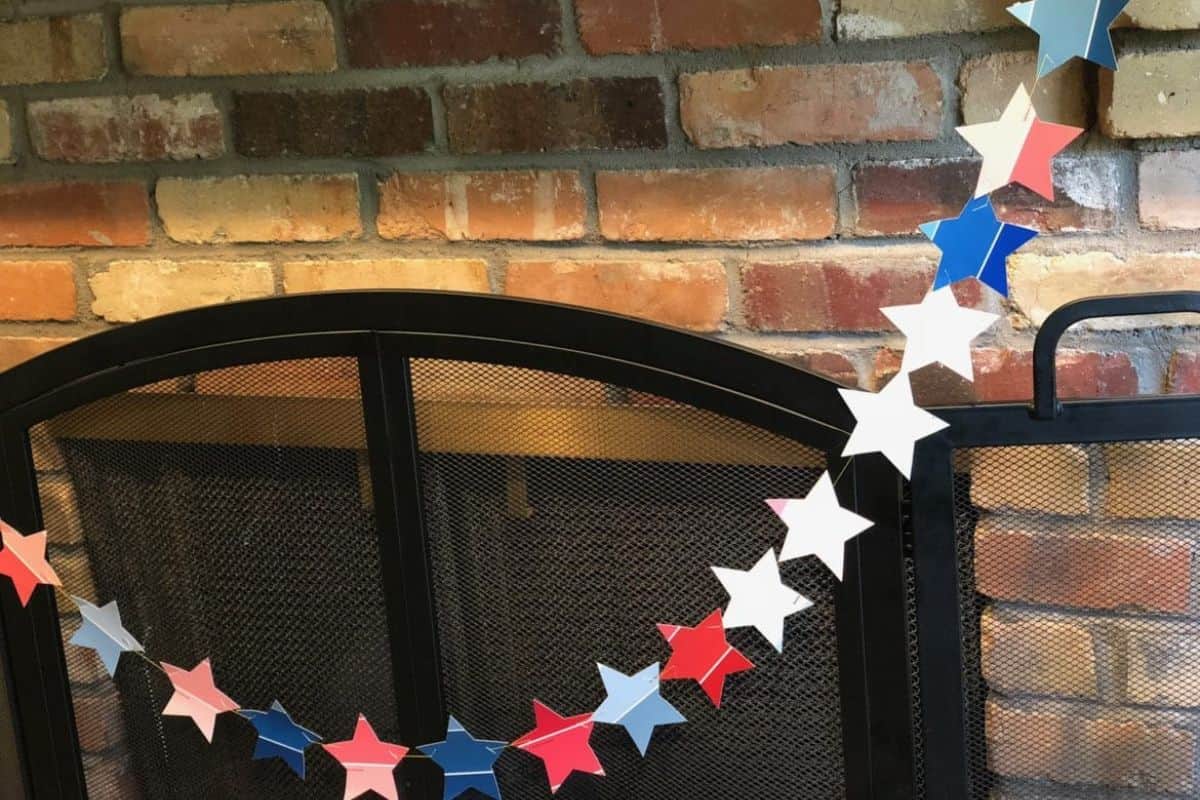 Patriotic Paint Chip Banner hanging on a fireplace mantel.