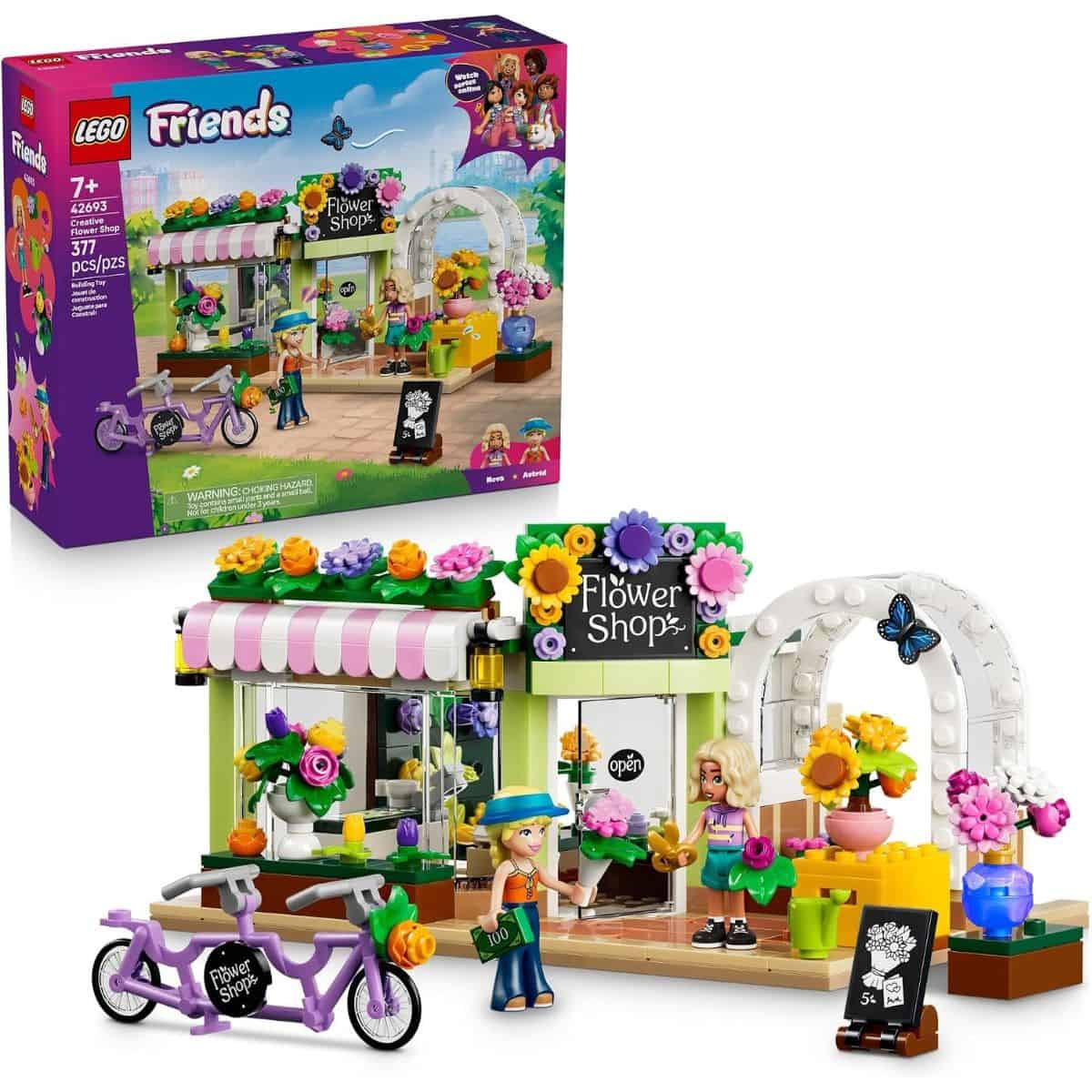 LEGO Friends Creative Flower Shop building set with colorful flowers, two mini-dolls, a purple bicycle, and a flower shop storefront.