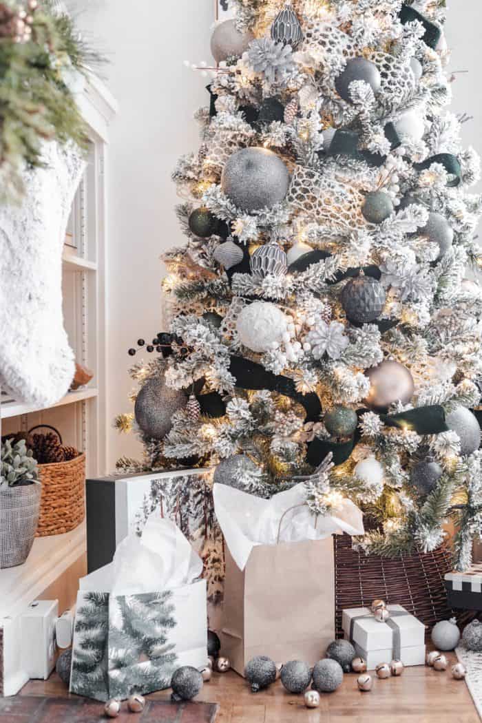 Neutral Modern Cozy Christmas Tree in living room next to built ins. #cherishedbliss #ChristmasTree