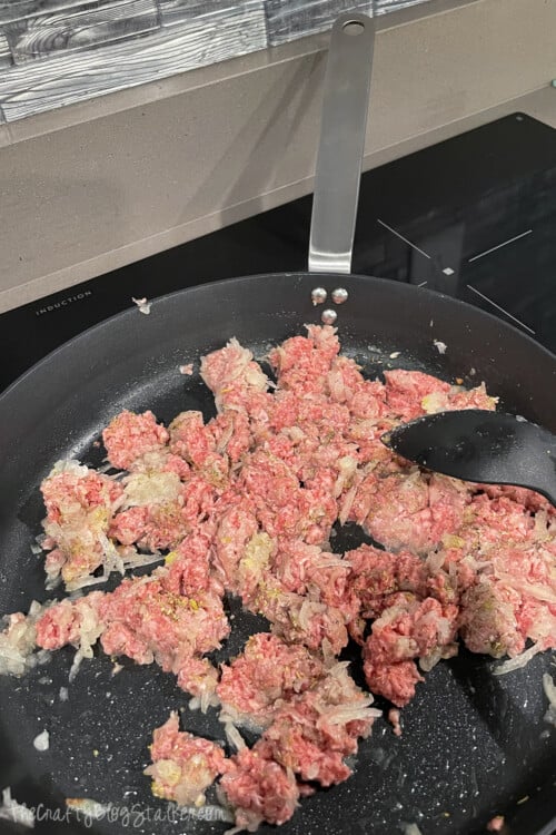 ground beef and onions in a skillet