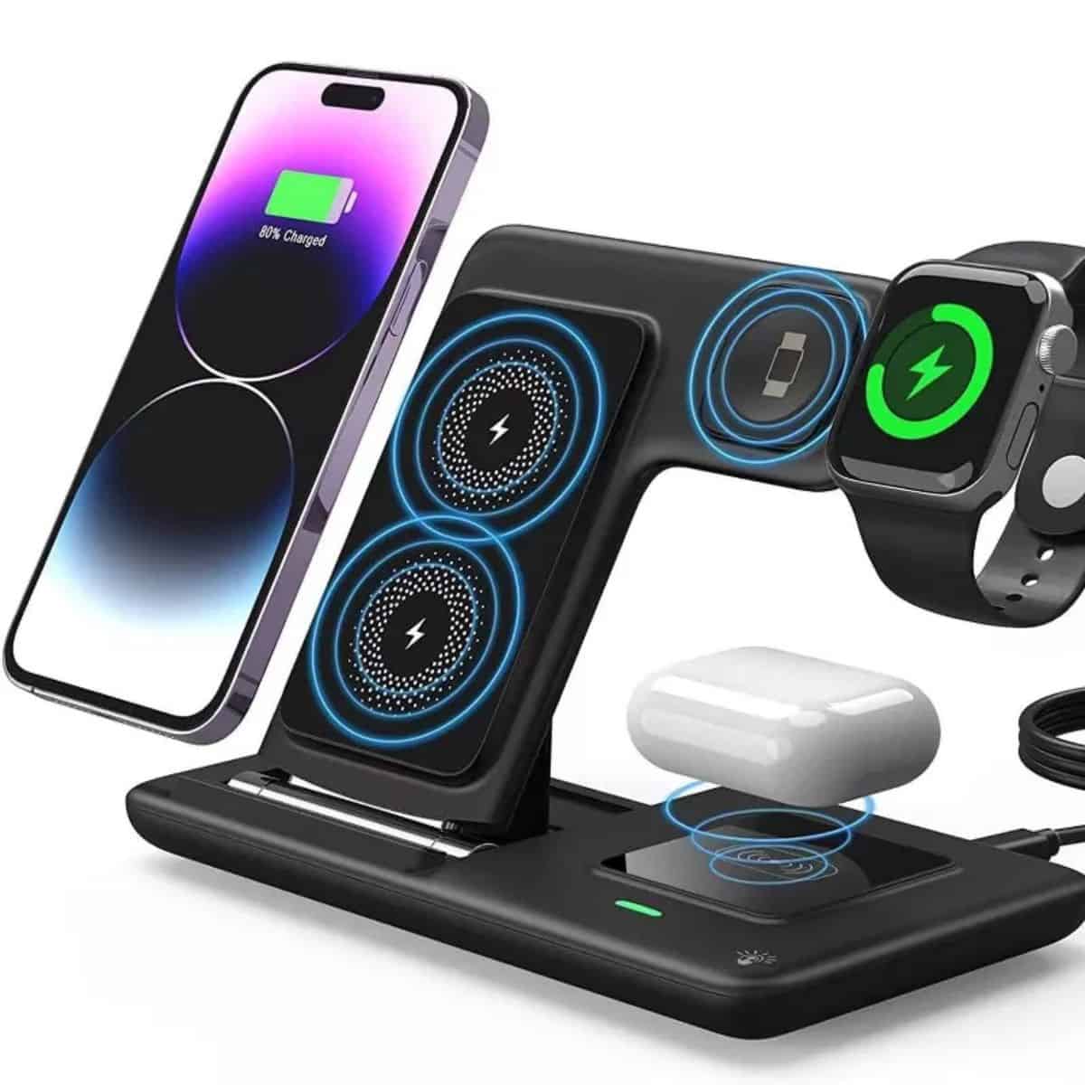 Black 3-in-1 wireless charging stand powering a smartphone, smartwatch, and wireless earbuds simultaneously with glowing blue charging indicators.