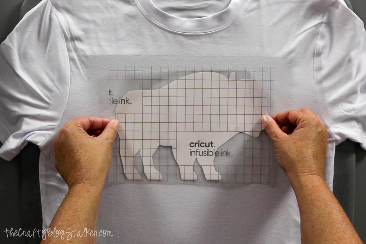 applying infusible ink transfer sheet to a tshirt