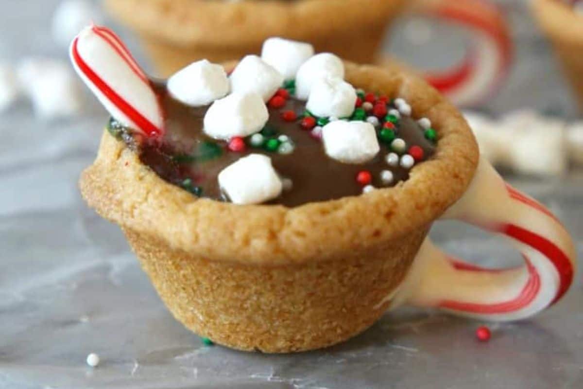 Hot Chocolate Cookie Cups with peppermint candy cane.
