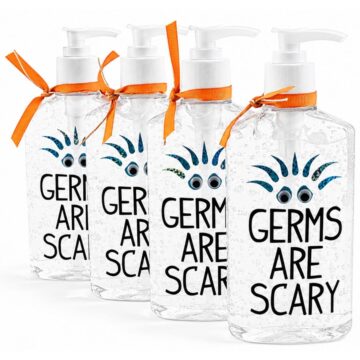 Four decorated hand sanitizer bottles with "Germs Are Scary" vinyl decals, googly eyes, and orange ribbon, arranged as funny DIY teacher appreciation gifts.