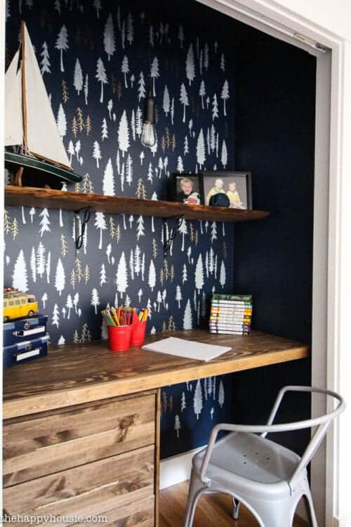 Closet turned into a workspace with beautiful stenciled feature wall art.