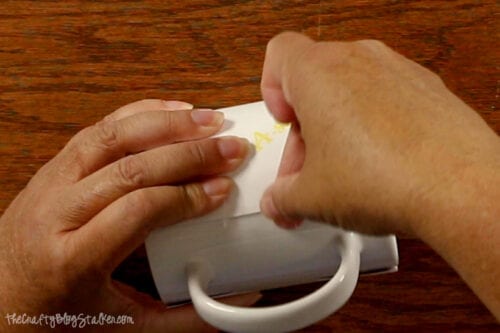 taping the design to a sublimation mug blank