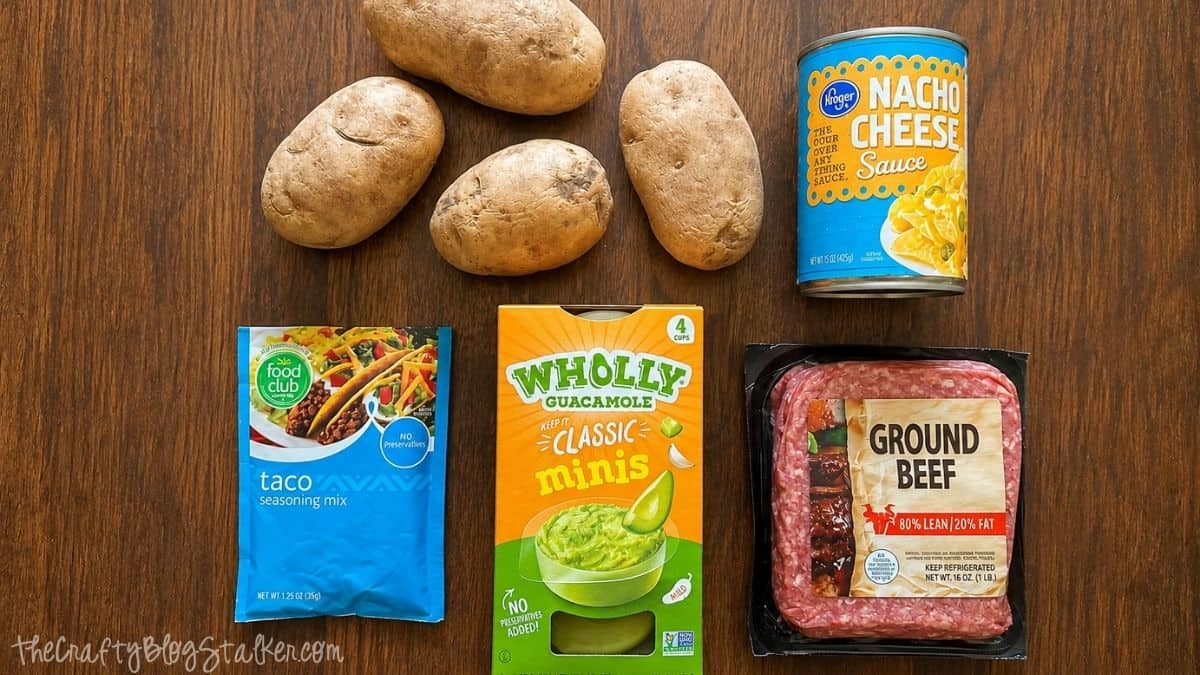Ingredients for loaded taco fries including russet potatoes, ground beef, taco seasoning, nacho cheese sauce, and single-serve guacamole cups.