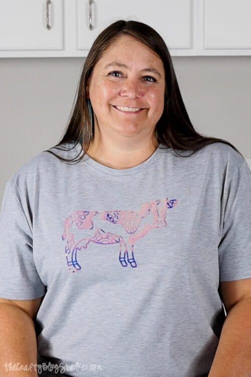 a woman wearing a cow shirt made with holographic iron-on