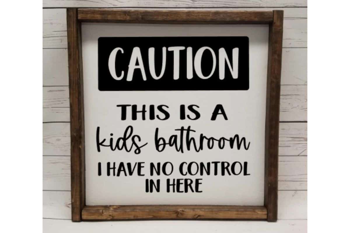 A sign that reads - caution this is a kids bathroom I have no control in here.