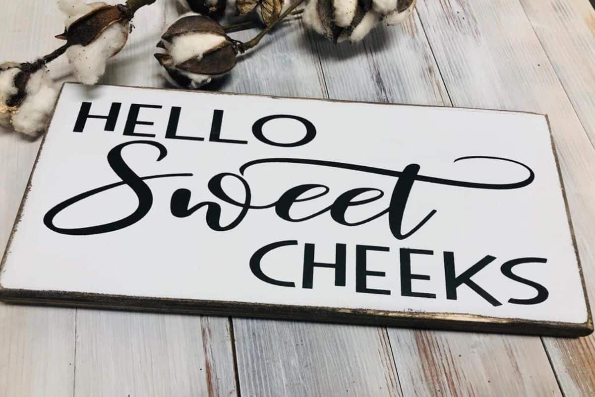 A sign that reads - hello sweet cheeks.