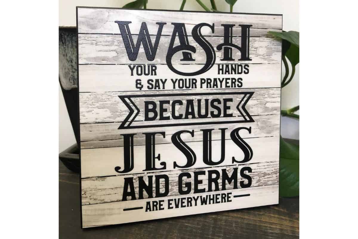 A sign that reads - wash your hands and say your prayers.