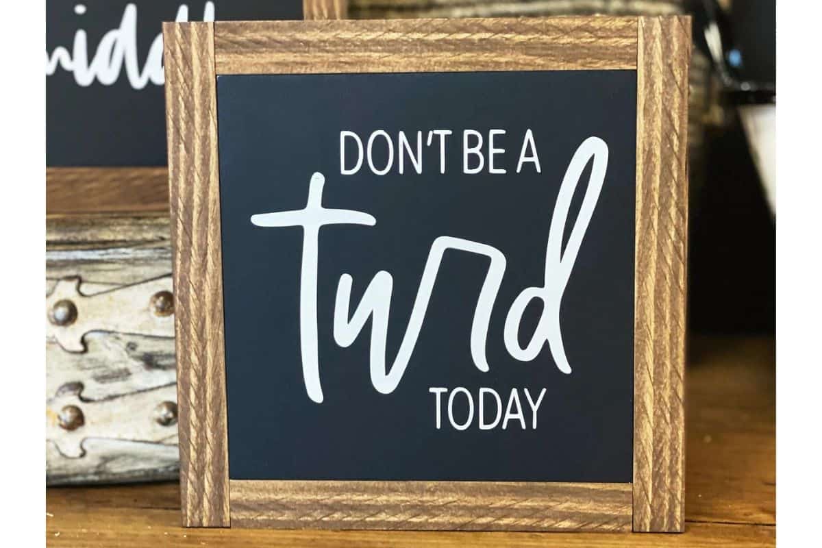 A sign that reads - Don't be a turd today.