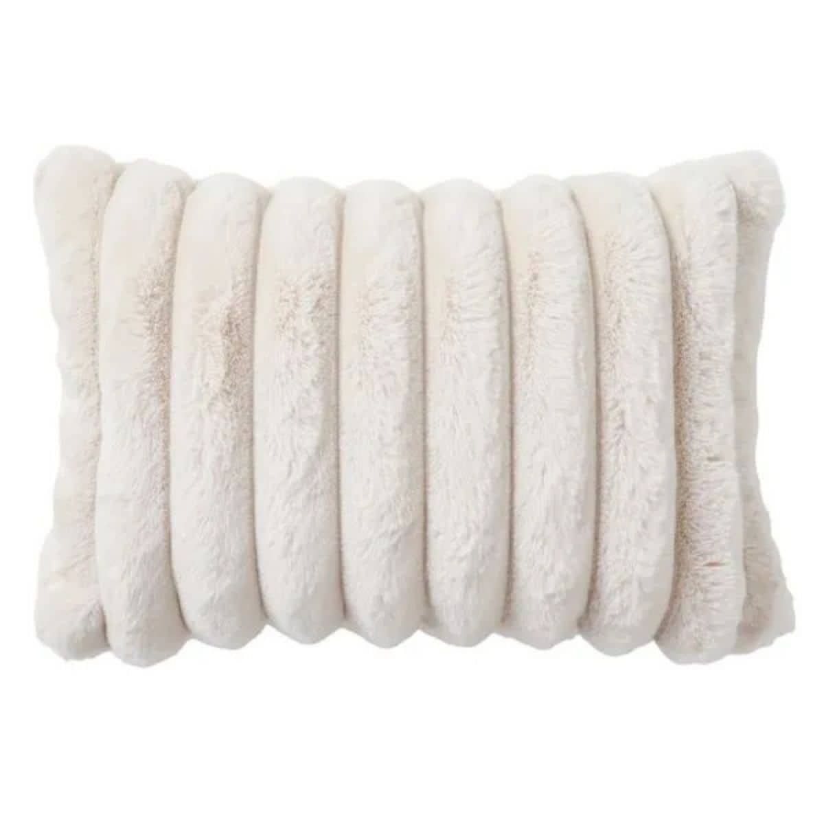Cream faux fur throw pillow with a soft plush texture and raised vertical ribbed design on a white background.