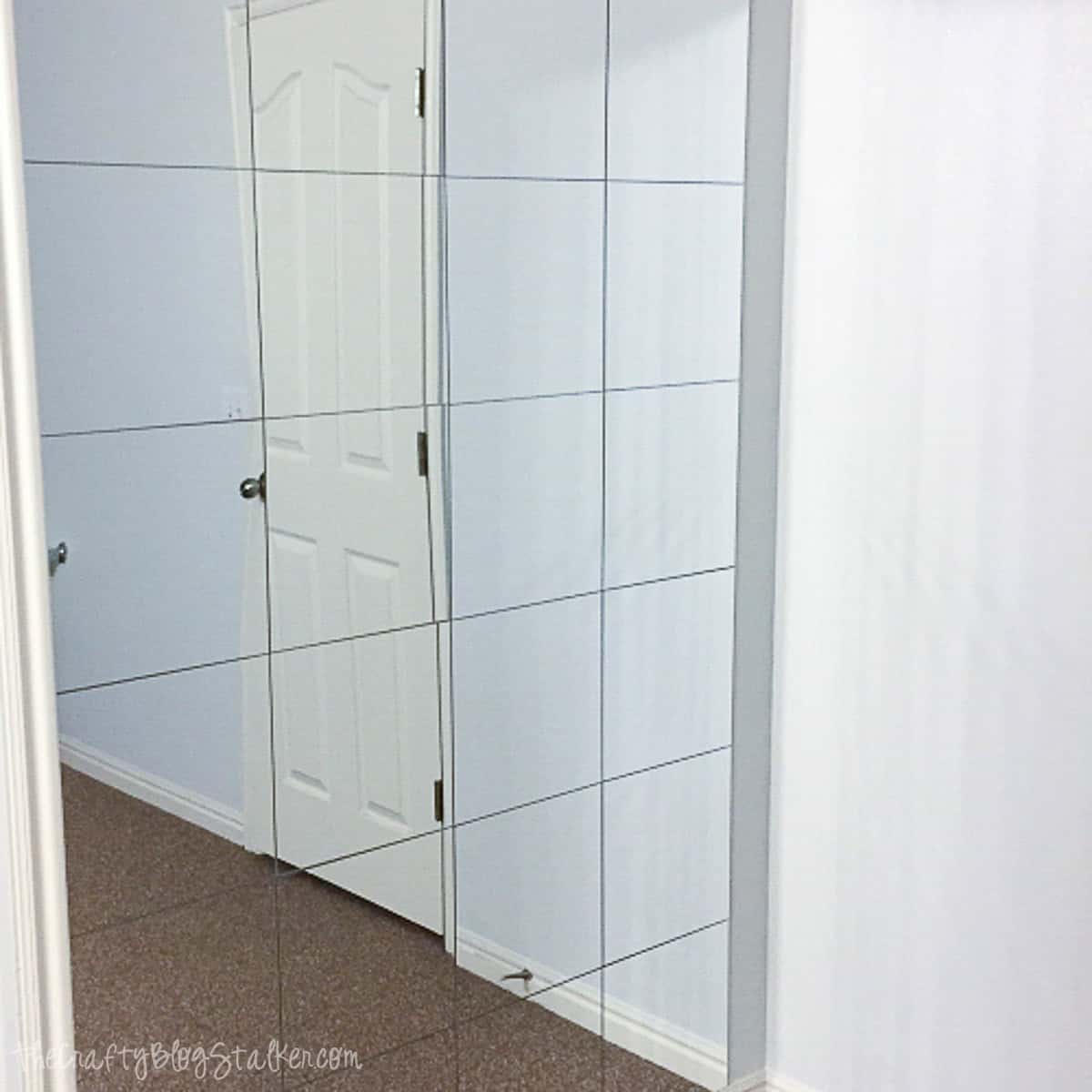 Mirror wall installation for a stylish home update.