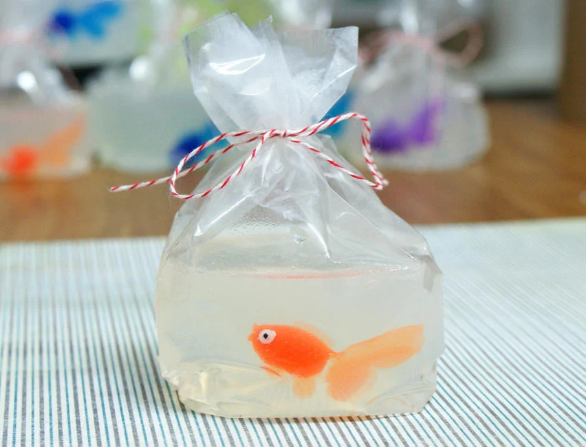 Clear melt and pour soap with a toy goldfish in the center.