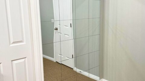 A mirrored wall made with mirror tiles.