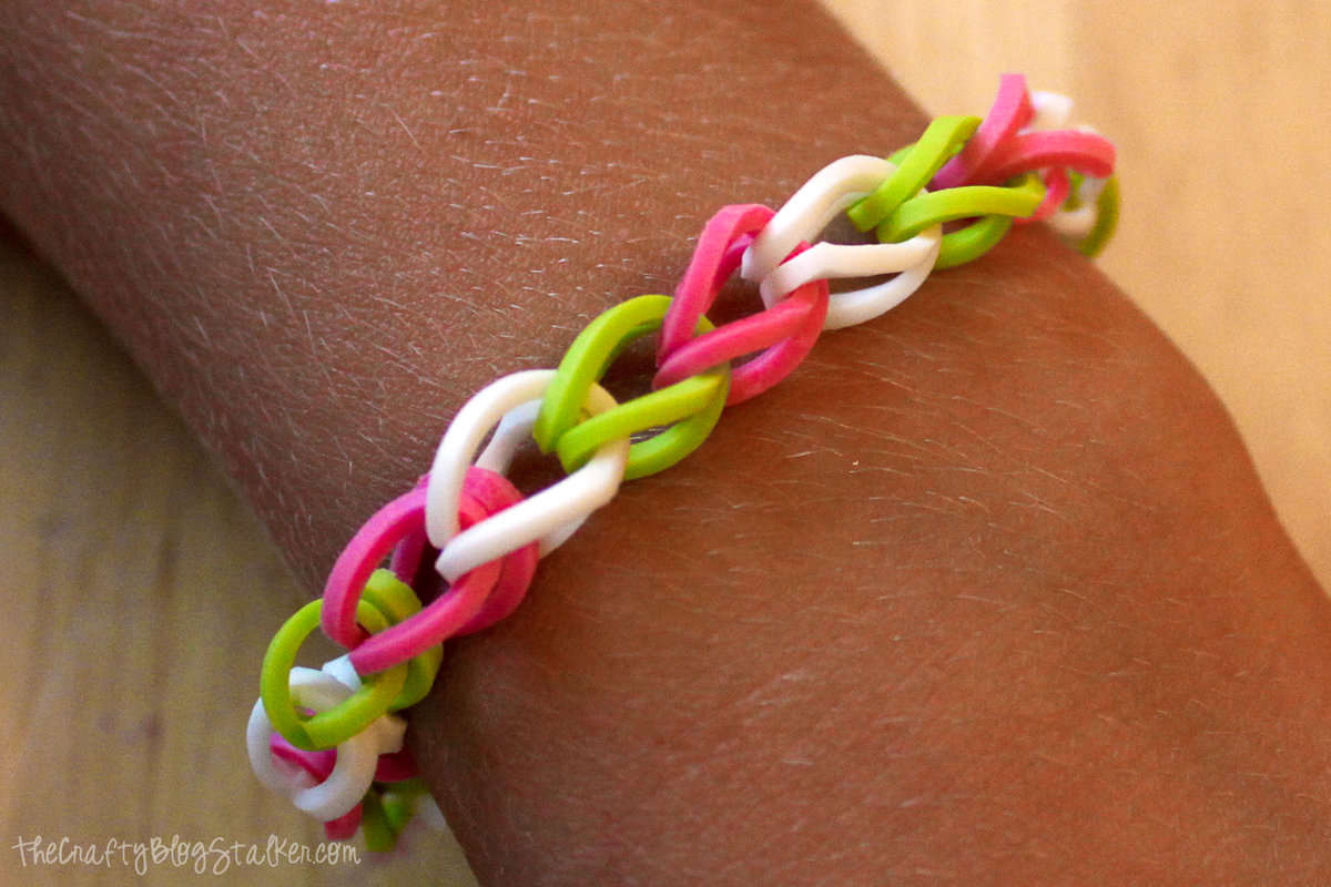 A wrist and a single chain rubber band bracelets.