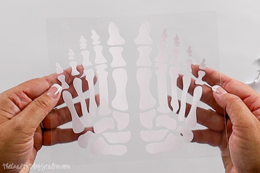 skeleton feet cut out of iron-on vinyl