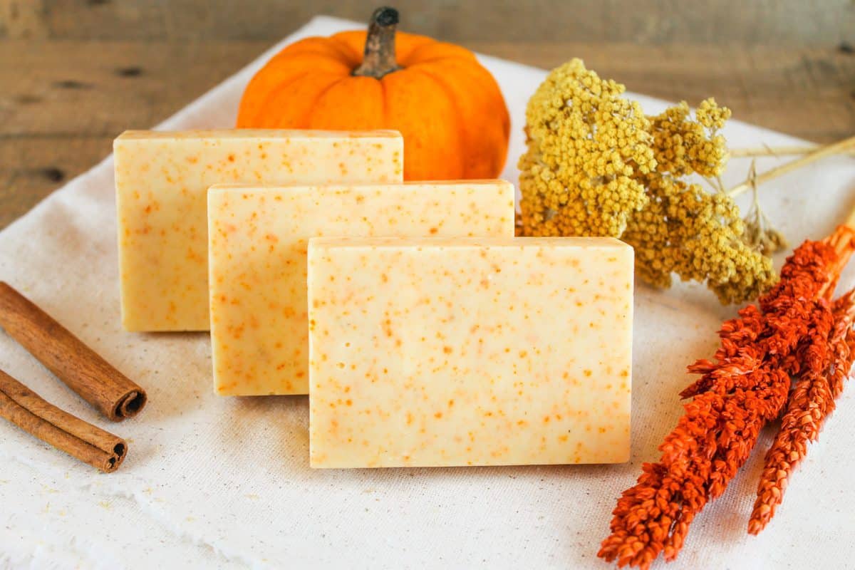 3 bars of sweet autumn spice soap on a white cloth.