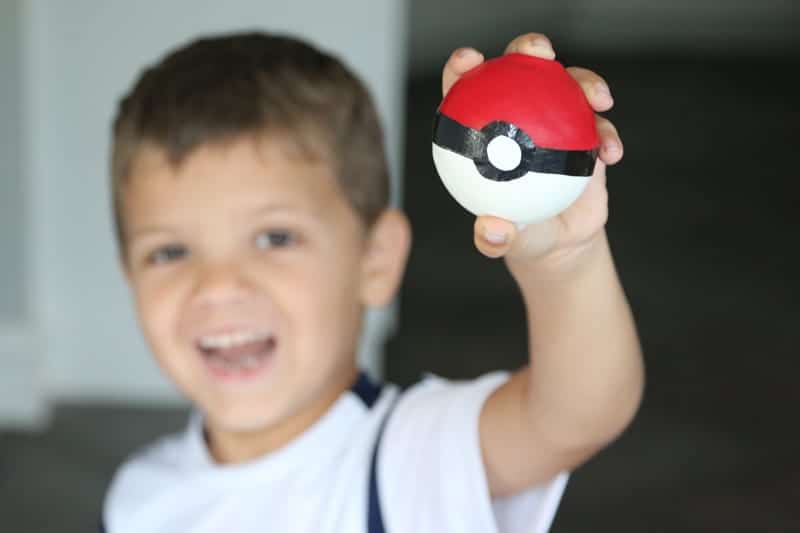 Boy holding a DIY Pokeball.