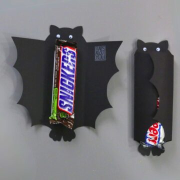 Halloween candy bar wrapper of a bat and a Snickers Candy Bar.