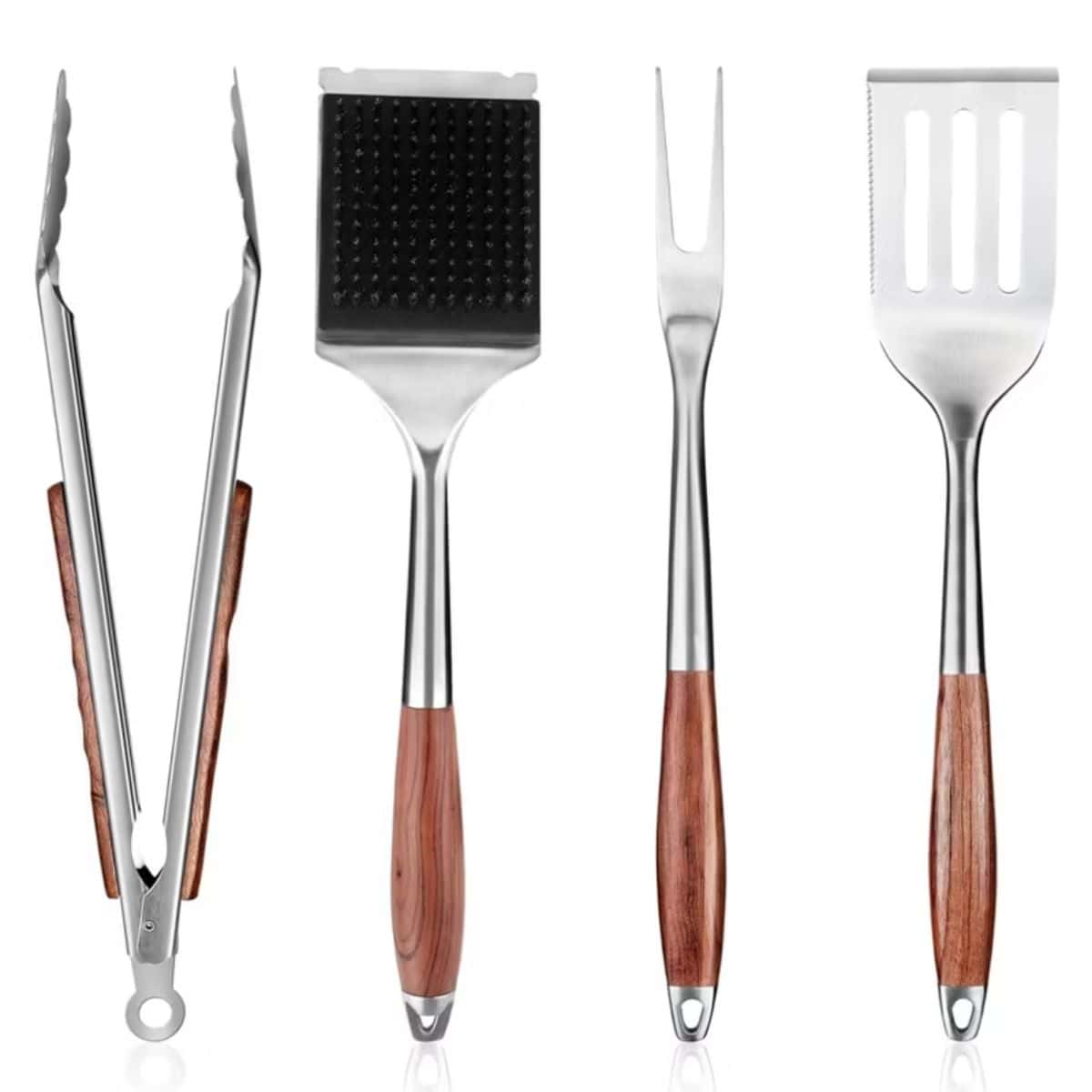 Set of stainless steel BBQ tools with wooden handles, including tongs, a fork, and a spatula with a cutout design, displayed on a white background.